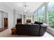 Bright living room with a fireplace and large windows offering scenic views at 32 Pullman Trl, Acworth, GA 30101