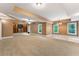 Spacious living room with built-in shelving, recessed lights, and large windows at 32 Pullman Trl, Acworth, GA 30101