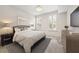 Cozy bedroom with neutral decor, plantation shutters, and carpet floor at 390 17Th Nw St # 2005, Atlanta, GA 30363