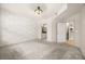 An empty bedroom with carpet floors and a decorative white brick accent wall at 390 17Th Nw St # 2005, Atlanta, GA 30363
