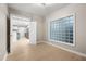An empty bedroom featuring hardwood floors and a unique glass block window at 390 17Th Nw St # 2005, Atlanta, GA 30363