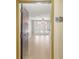 Bright entryway with hardwood floors, leading to a living area with a ceiling fan and french doors to a balcony at 390 17Th Nw St # 2005, Atlanta, GA 30363