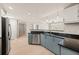 Stylish kitchen featuring modern appliances, sleek cabinetry, and a view into the living room at 390 17Th Nw St # 2005, Atlanta, GA 30363