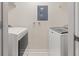 A well-lit laundry room featuring a modern washer and dryer at 390 17Th Nw St # 2005, Atlanta, GA 30363