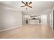 Open-concept living room featuring hardwood floors, modern lighting, and a doorway to the kitchen at 390 17Th Nw St # 2005, Atlanta, GA 30363