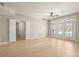 Bright and airy living room with hardwood floors, fresh paint, and a doorway to bath at 390 17Th Nw St # 2005, Atlanta, GA 30363