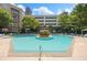 Community pool area with lounge chairs, a gazebo, and lush landscaping at 390 17Th Nw St # 2005, Atlanta, GA 30363