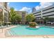 Community pool featuring several lounge chairs and landscaping at 390 17Th Nw St # 2005, Atlanta, GA 30363