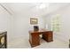 A bedroom with white walls, carpet, a wooden desk and closet doors at 1117 Haven Glen Ne Ln, Brookhaven, GA 30319