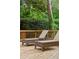 Outdoor deck with two wicker lounge chairs and small table to enjoy a peaceful setting at 1117 Haven Glen Ne Ln, Brookhaven, GA 30319