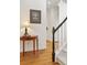 Bright foyer with hardwood floors, staircase, and side table with lamp at 1117 Haven Glen Ne Ln, Brookhaven, GA 30319