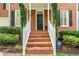 Close up of the brick front steps leading up to a black front door with a security system sign at 1117 Haven Glen Ne Ln, Brookhaven, GA 30319