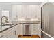 Bright and modern kitchen featuring stainless steel appliances and white cabinets at 1117 Haven Glen Ne Ln, Brookhaven, GA 30319