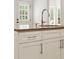 Close-up on kitchen island featuring white cabinets, stainless hardware, and granite countertops at 1117 Haven Glen Ne Ln, Brookhaven, GA 30319