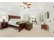 Spacious main bedroom with a trey ceiling, neutral carpet, plantation shutters and stylish furnishings at 1117 Haven Glen Ne Ln, Brookhaven, GA 30319