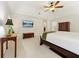 Spacious main bedroom with a tray ceiling, ceiling fan, recessed lighting, and large windows at 1117 Haven Glen Ne Ln, Brookhaven, GA 30319