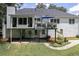 Backyard featuring a deck with a blue umbrella, a well manicured yard and patio at 2355 Quail Creek Ter, Buford, GA 30519