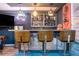 Home bar area, with custom lighting and bar stools at 2355 Quail Creek Ter, Buford, GA 30519