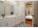 Bathroom showcasing double vanity with decorative tile floor at 2355 Quail Creek Ter, Buford, GA 30519
