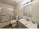 Compact bathroom with shower-tub combo, modern vanity, and updated fixtures at 2355 Quail Creek Ter, Buford, GA 30519