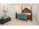 Bedroom showcasing ornate four-poster bed frame, carpeting, and ample natural light at 2355 Quail Creek Ter, Buford, GA 30519