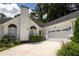 A pristine white house is coupled with an ample driveway at 2355 Quail Creek Ter, Buford, GA 30519