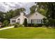 Traditional home featuring neat landscaping, a green lawn, and a driveway at 2355 Quail Creek Ter, Buford, GA 30519