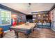 Entertaining game room with pool table, bar area, and unique lighting features at 2355 Quail Creek Ter, Buford, GA 30519