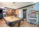 Stylish game room featuring a pool table, bar, and unique decorative elements at 2355 Quail Creek Ter, Buford, GA 30519