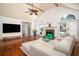 Open-concept living room featuring hardwood floors and vaulted ceilings at 2355 Quail Creek Ter, Buford, GA 30519