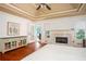 This spacious main bedroom features a fireplace and french doors at 2355 Quail Creek Ter, Buford, GA 30519