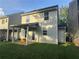 The back of the property features a covered patio, an extra storage area and a lush green yard for outdoor enjoyment at 241 Coral Cir, Mcdonough, GA 30253