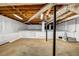 Clean basement with white walls, concrete floor, and exposed ceiling with ductwork at 2585 Regency E Dr, Tucker, GA 30084