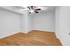 Cozy bedroom featuring hardwood floors, a ceiling fan and a closet for storage at 2585 Regency E Dr, Tucker, GA 30084