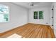 Bright bedroom with hardwood floors, ceiling fan and natural light streaming through the windows at 2585 Regency E Dr, Tucker, GA 30084