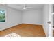 Bedroom with hardwood floors, a ceiling fan and natural light from a window at 2585 Regency E Dr, Tucker, GA 30084