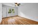 Bright bedroom with hardwood floors and a large window, offering a tranquil retreat at 2585 Regency E Dr, Tucker, GA 30084