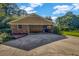 Spacious two-car carport with additional storage and a large driveway for easy parking at 2585 Regency E Dr, Tucker, GA 30084