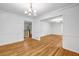 Open dining and living room featuring crown moulding, hardwood floors and natural light at 2585 Regency E Dr, Tucker, GA 30084