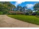 Well-manicured lawn and landscaping showcase the beautiful brick home, enhancing its curb appeal at 2585 Regency E Dr, Tucker, GA 30084