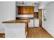 Kitchen featuring granite countertops, white appliances, and wood cabinetry at 2585 Regency E Dr, Tucker, GA 30084