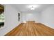 Light-filled living room showcasing hardwood floors, white walls and large windows at 2585 Regency E Dr, Tucker, GA 30084
