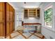 Home office space with custom desk, storage cabinets, and a view of the backyard at 2585 Regency E Dr, Tucker, GA 30084