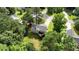 Aerial view of the home highlighting the deck, backyard, and surrounding greenery at 310 Willow Ln, Temple, GA 30179