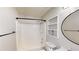 Compact bathroom features a tub/shower combo, toilet, and mirror at 310 Willow Ln, Temple, GA 30179