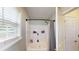 Bright bathroom with a shower/tub combo and a window for natural light at 310 Willow Ln, Temple, GA 30179