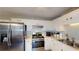 Well-appointed kitchen with white cabinets, stainless steel appliances, and ample counter space at 310 Willow Ln, Temple, GA 30179