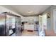Well-lit kitchen with stainless steel appliances, white cabinetry and access to the deck at 310 Willow Ln, Temple, GA 30179