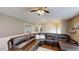 Comfortable living room with a large sectional sofa and ample natural light at 310 Willow Ln, Temple, GA 30179