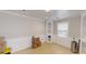 Spacious living room with custom shelving, tile floors, wainscoting and a large window at 310 Willow Ln, Temple, GA 30179